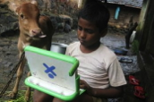 Poor Indian child with world's cheapest laptop ($100).